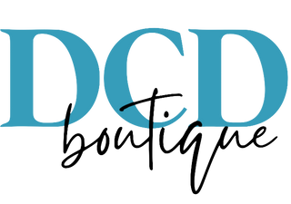 Logo of DCD boutique with 'DCD' in blue and 'boutique' in black cursive text on a white background.